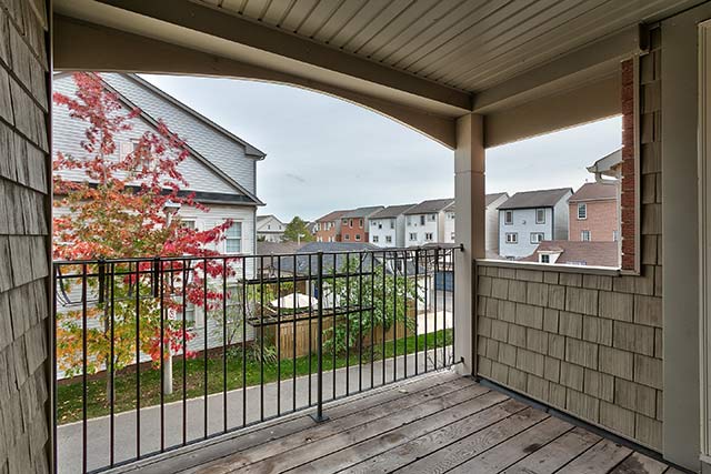 Covered balcony off of living room.
