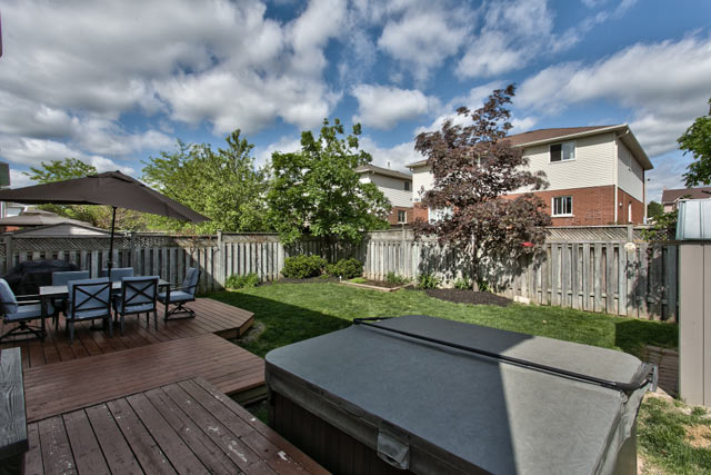 Backyard with hot tub.